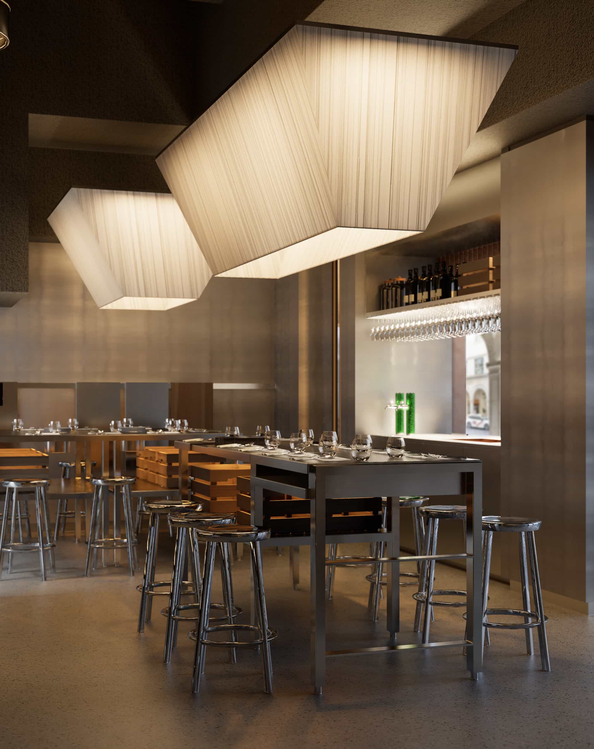 Taburetes altos de acero con estética industrial en la zona de barra y mesas altas del restaurante Trescero en Granada.